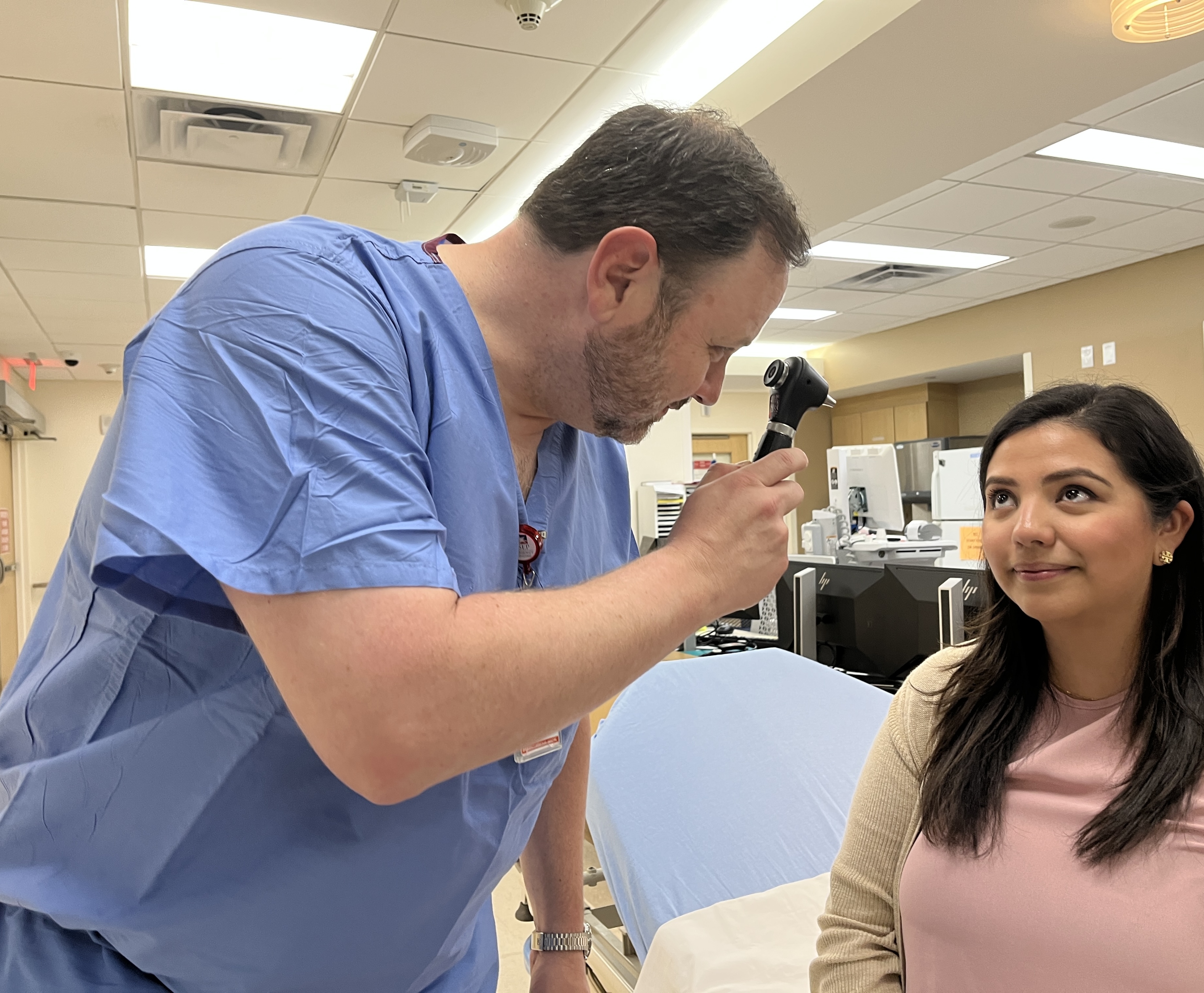 Dr. Justin Williams meets with a patient in the Emergency Department