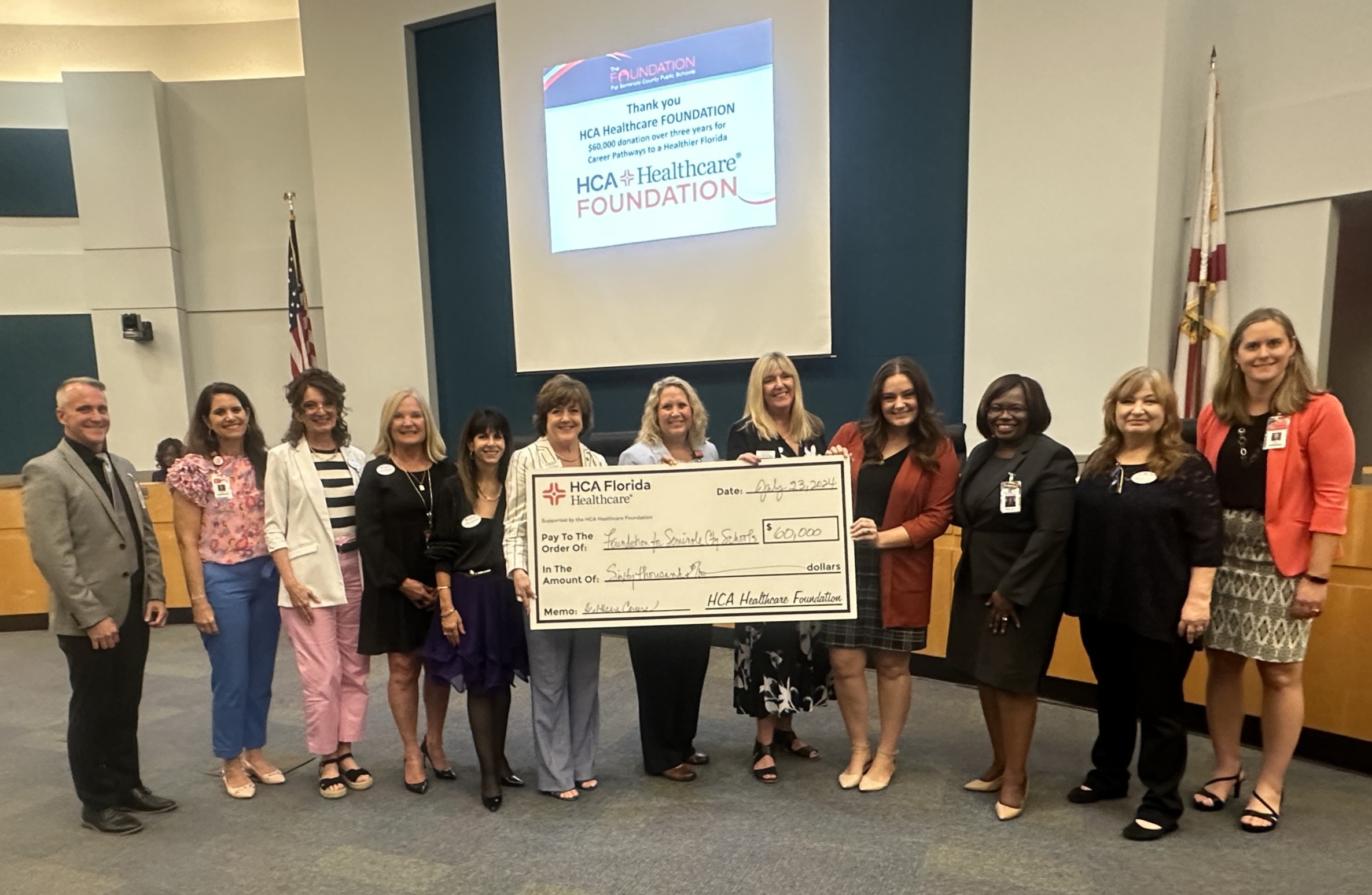Students stand with HCA Healthcare Foundation's $1 million grant.