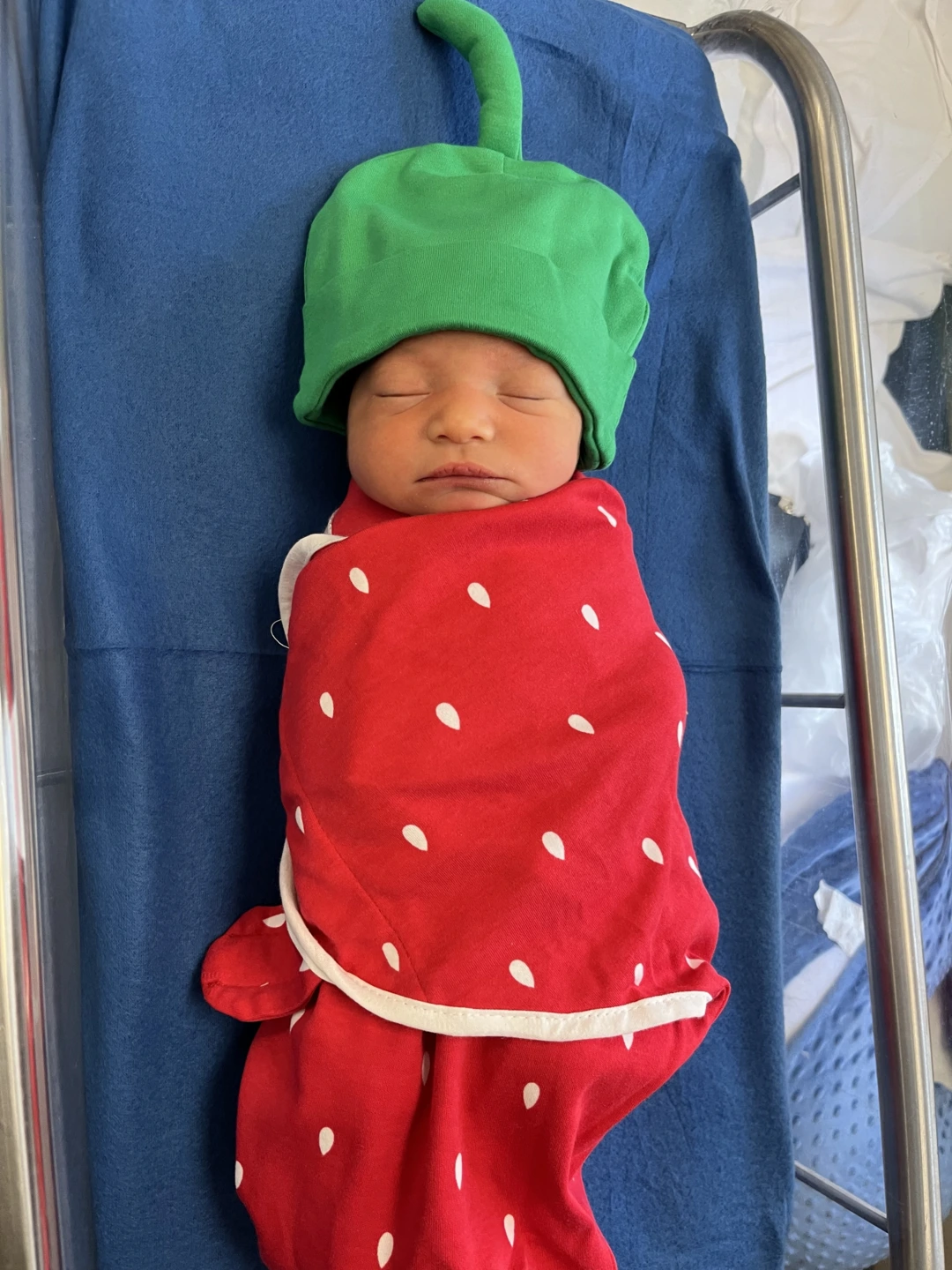 a baby dressed like a strawberry
