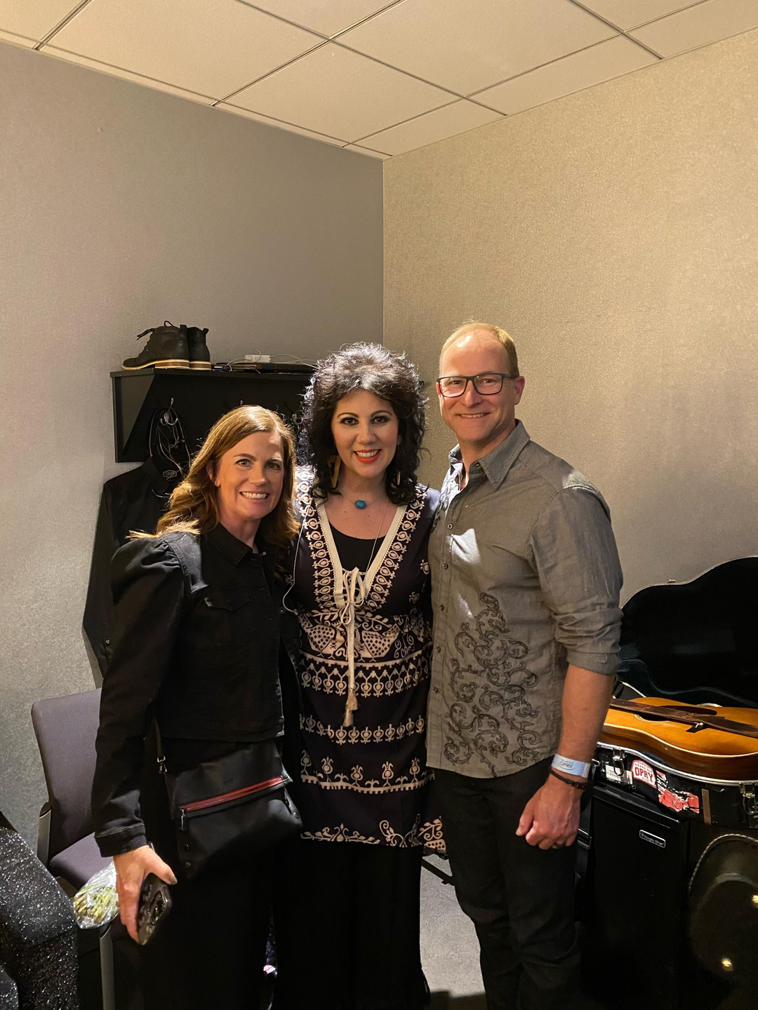 Issacs with Gretchen Miller, Director of Rehabilitation Services, and Dr. Scott Mandell backstage at the Grand Ole Opry.
