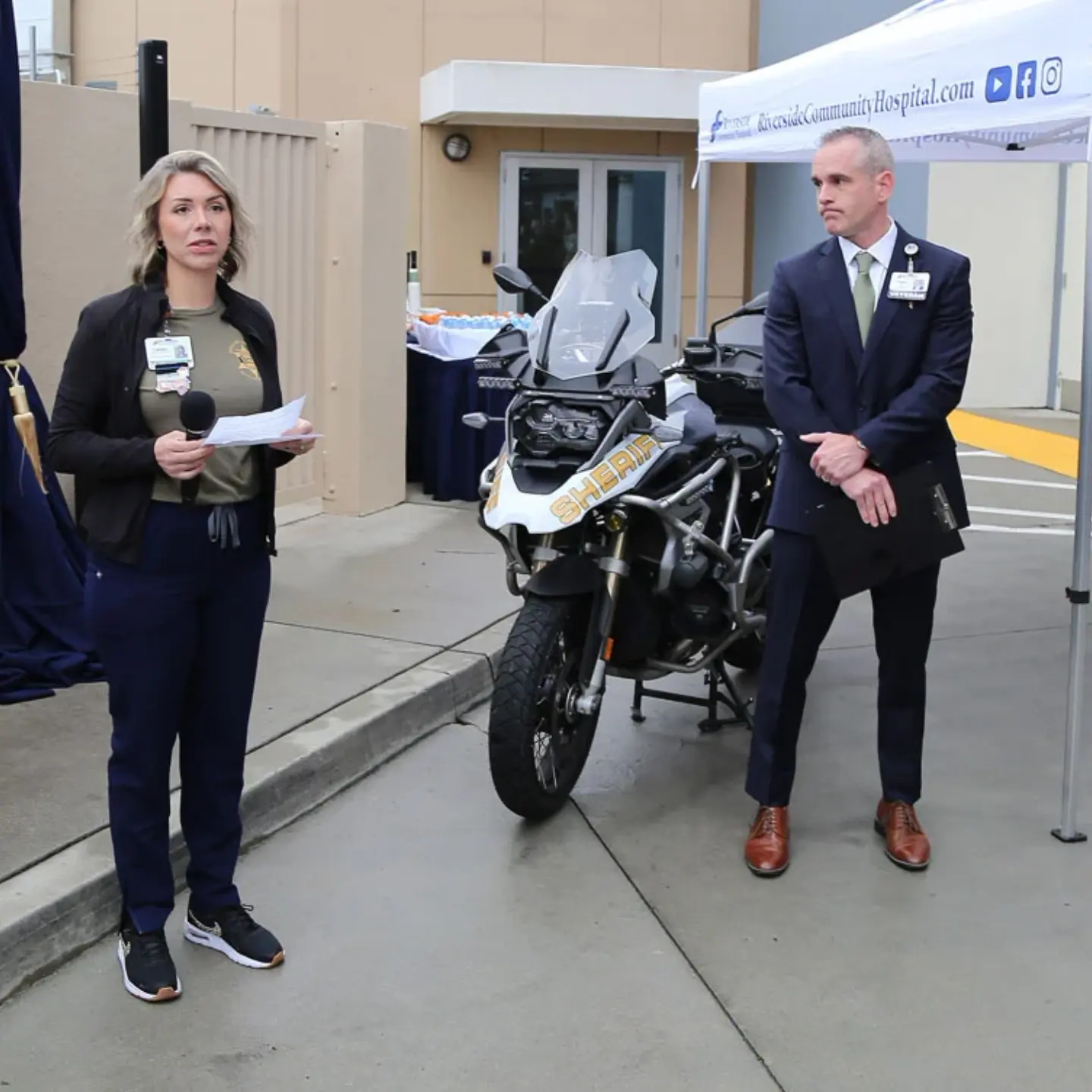 Lacey Page, pre-hospital liaison nurse at Riverside Community Hospital, speaks during a dedication ceremony for a parking spot in honor of Sheriff Deputy Timothy Corlew.