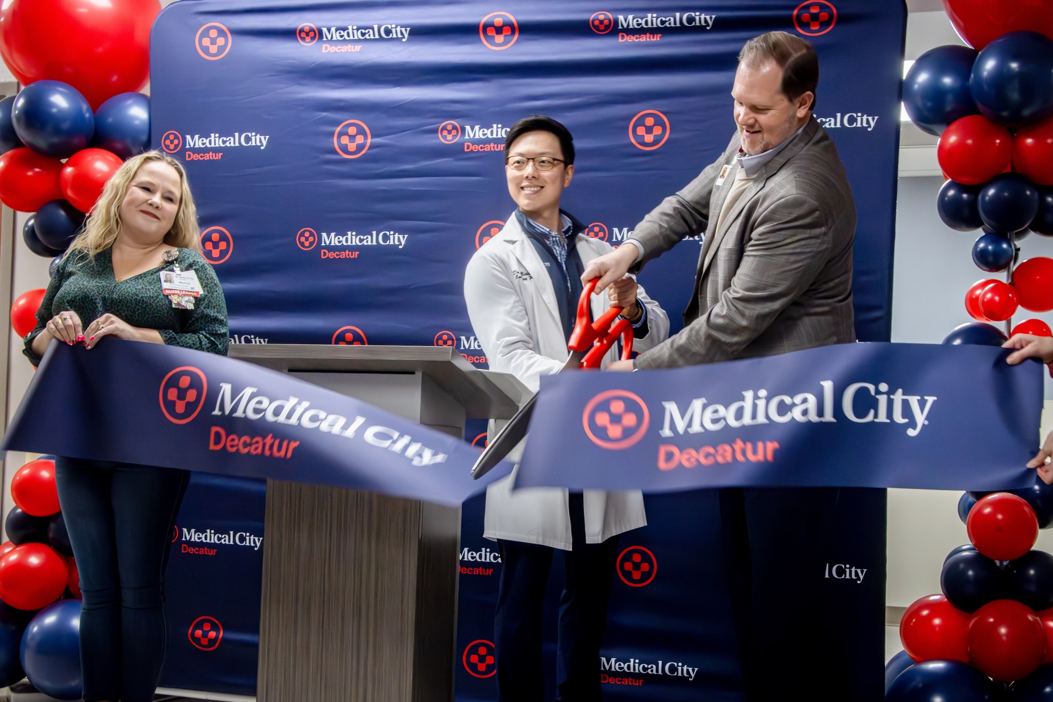 Medical City Decatur Hospital official ribbon cutting photo for ER expansion. Pictured (left to right): Monica Schumpert, RN, Dr. Michael Hong, medical director of Medical City Decatur’s emergency department, and Jason Wren, Medical City Decatur