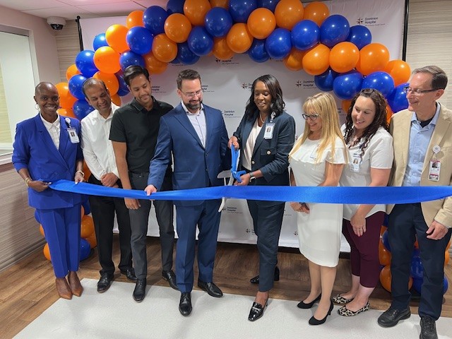 HCA Florida team members cutting ceremonial ribbon at grand opening.