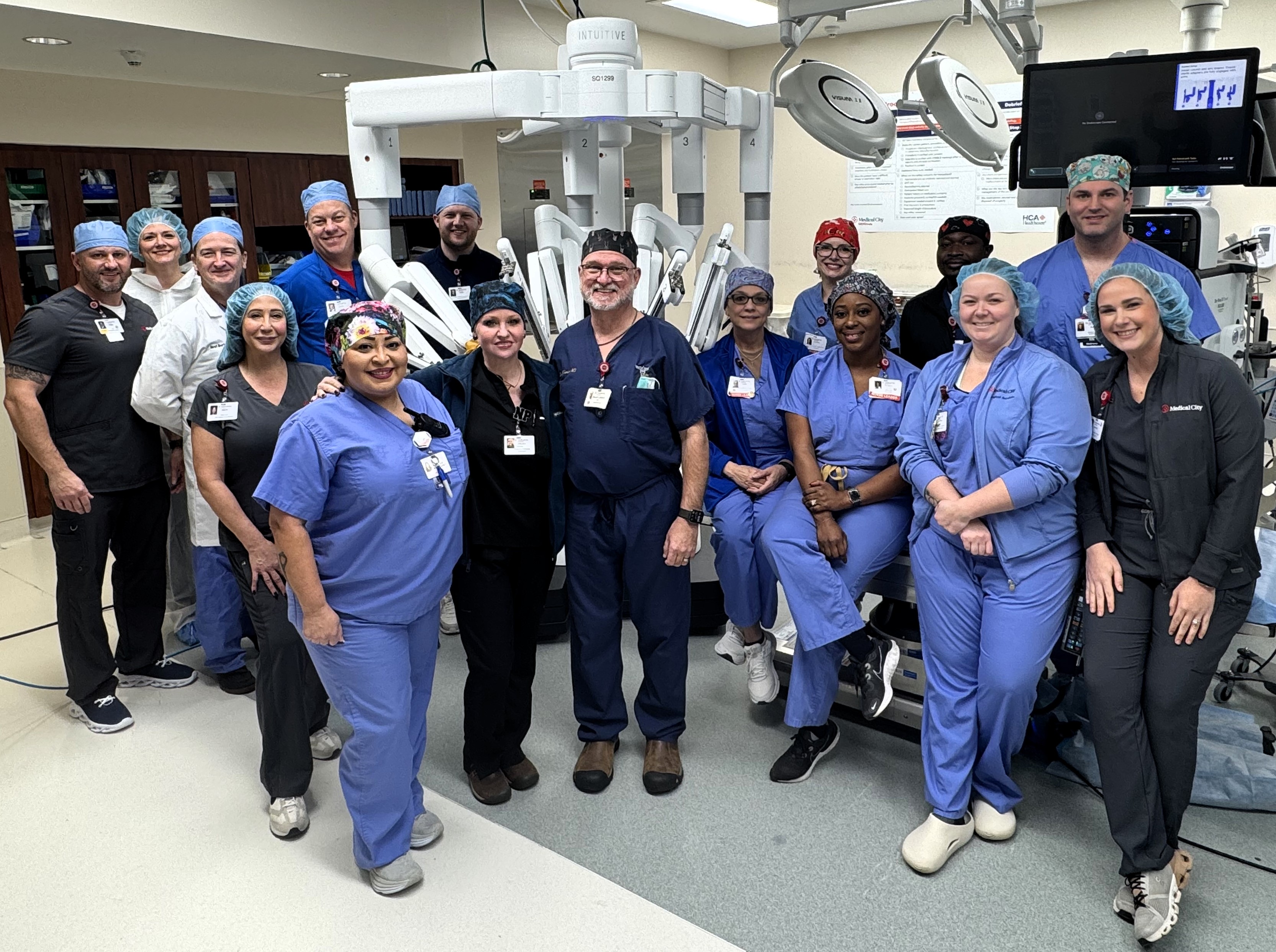 Medical City McKinney staff photo in front of surgical robot