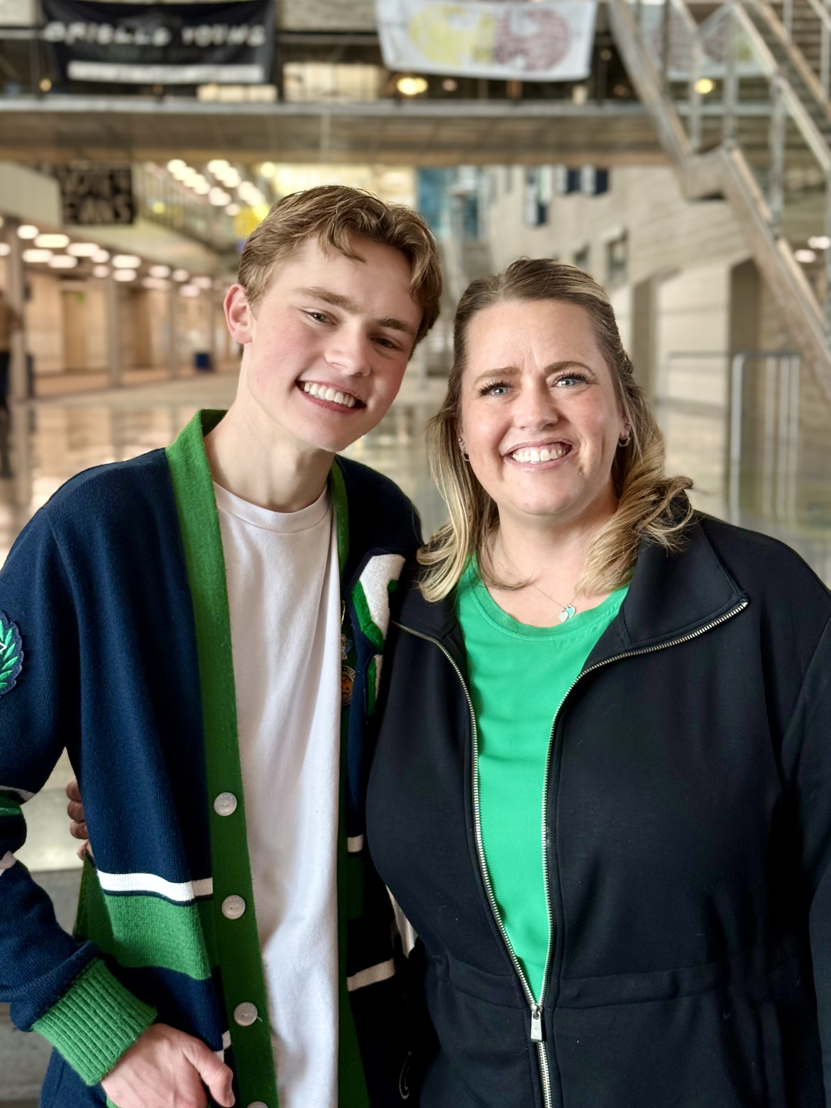 Photo of Rachel and her son Nate inside Syracuse High School.