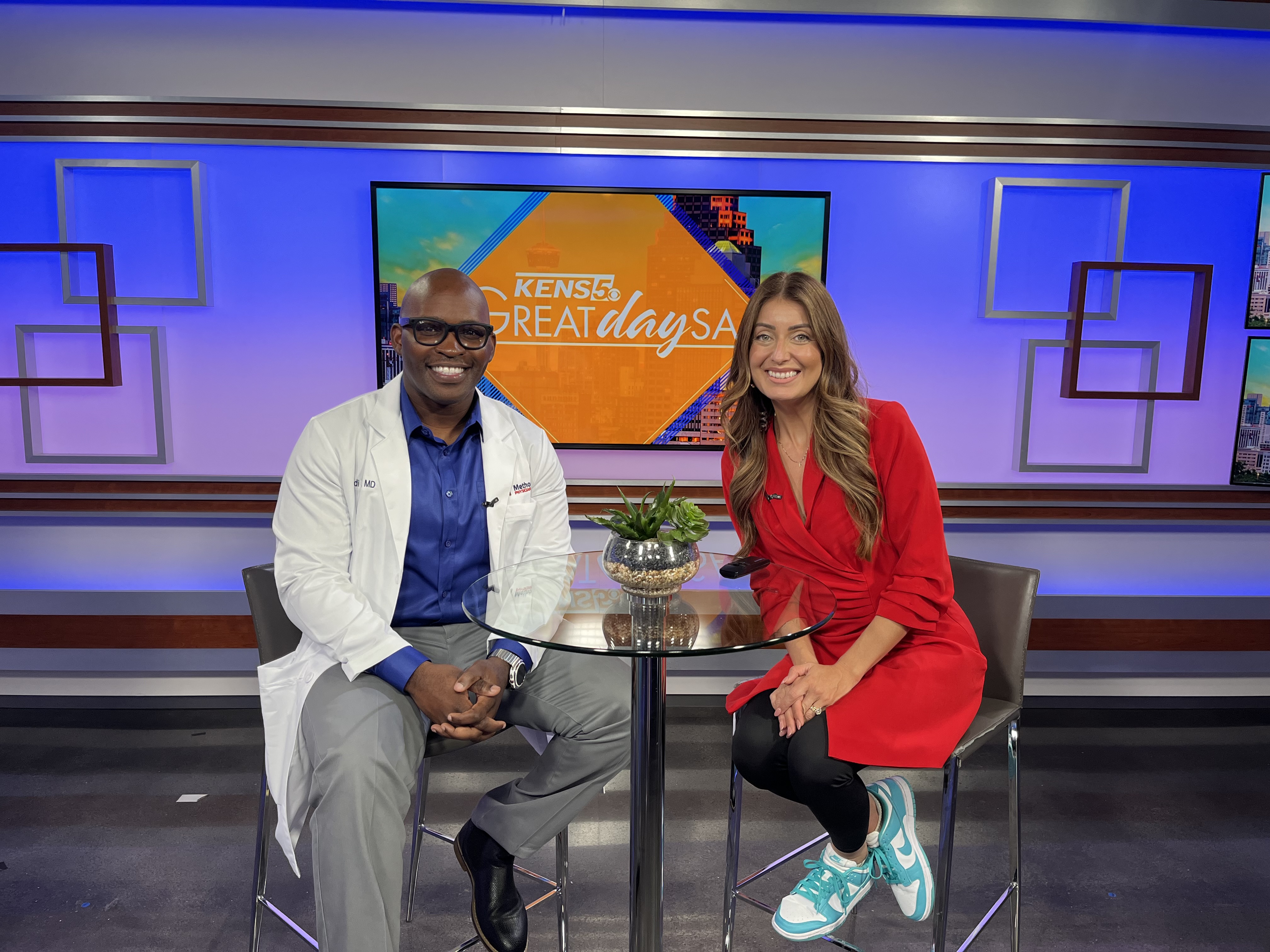 Dr. Batts poses with KENS 5 anchor Roma Villavicencio during a Great Day SA segment.