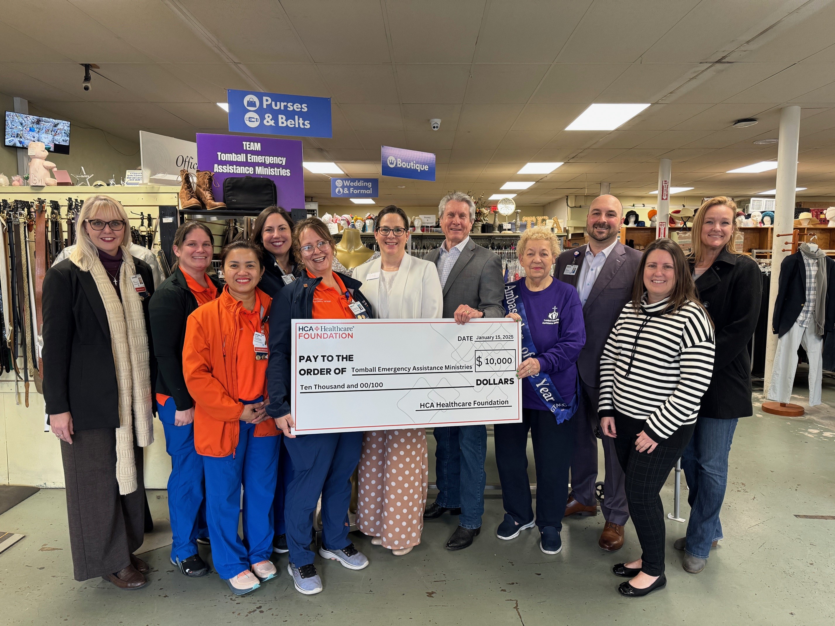 Representatives posing with donation check.
