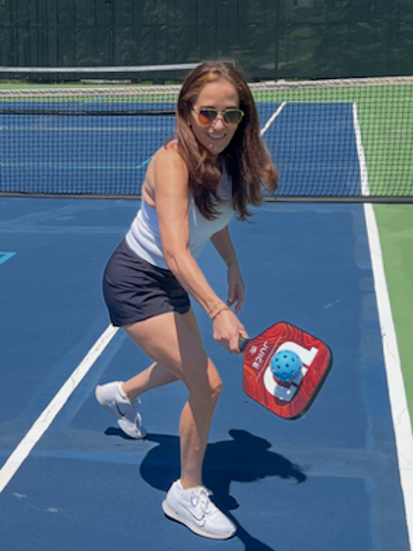 Laura playing pickleball.