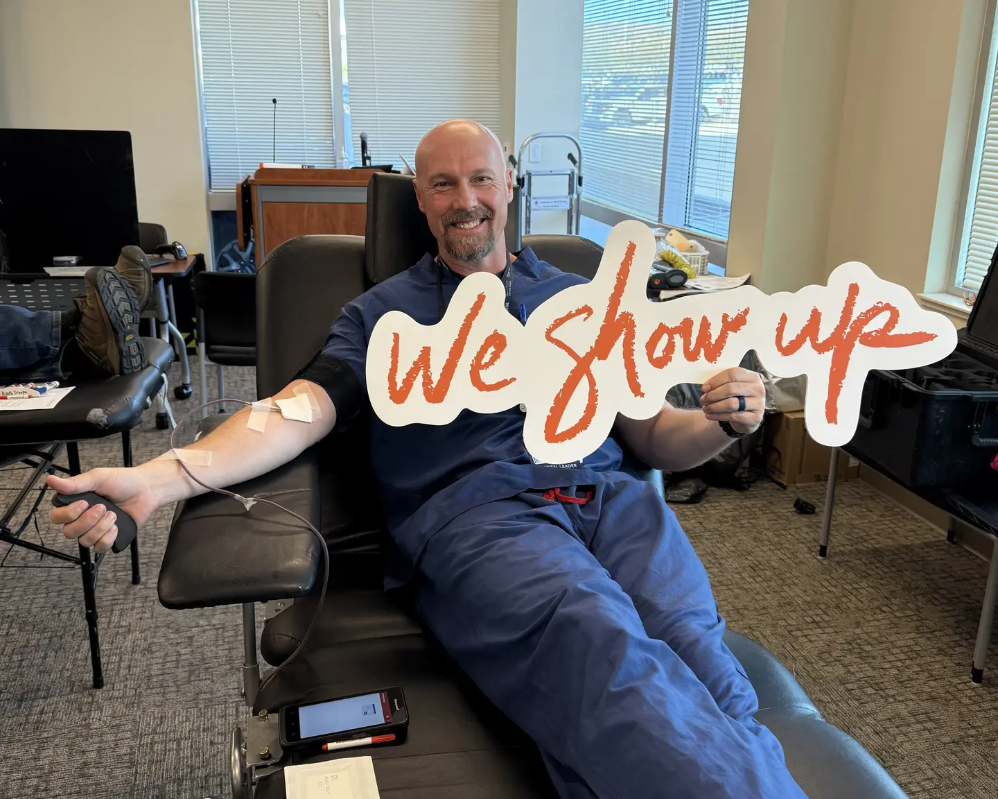 A Lone Peak Hospital colleague donates blood during volunteer month