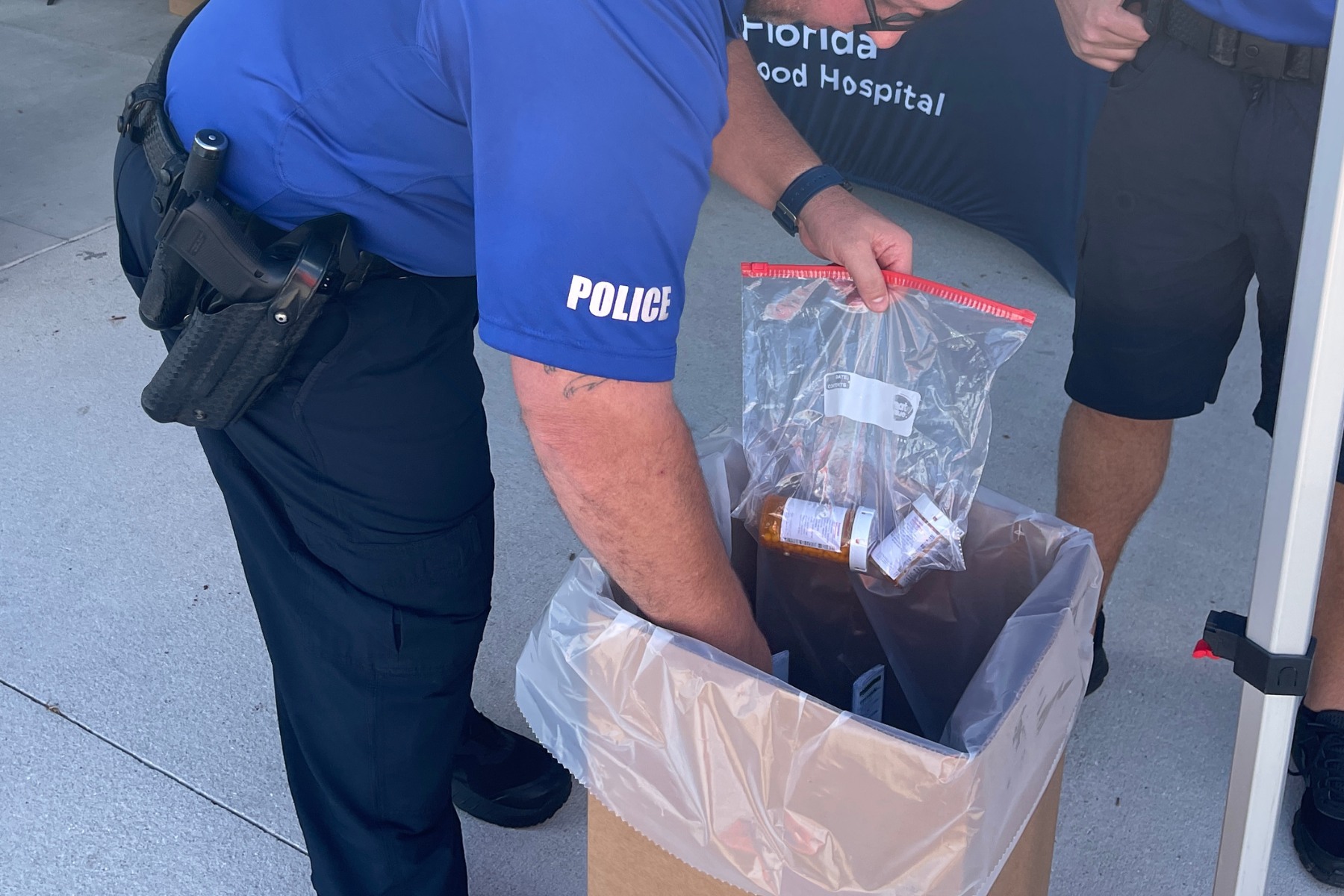 North Port police officer accepts prescription drugs during a drug take-back day