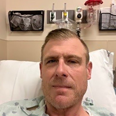 Mike Malay smiling during an A-Fib treatment at St. Mark's Hospital.
