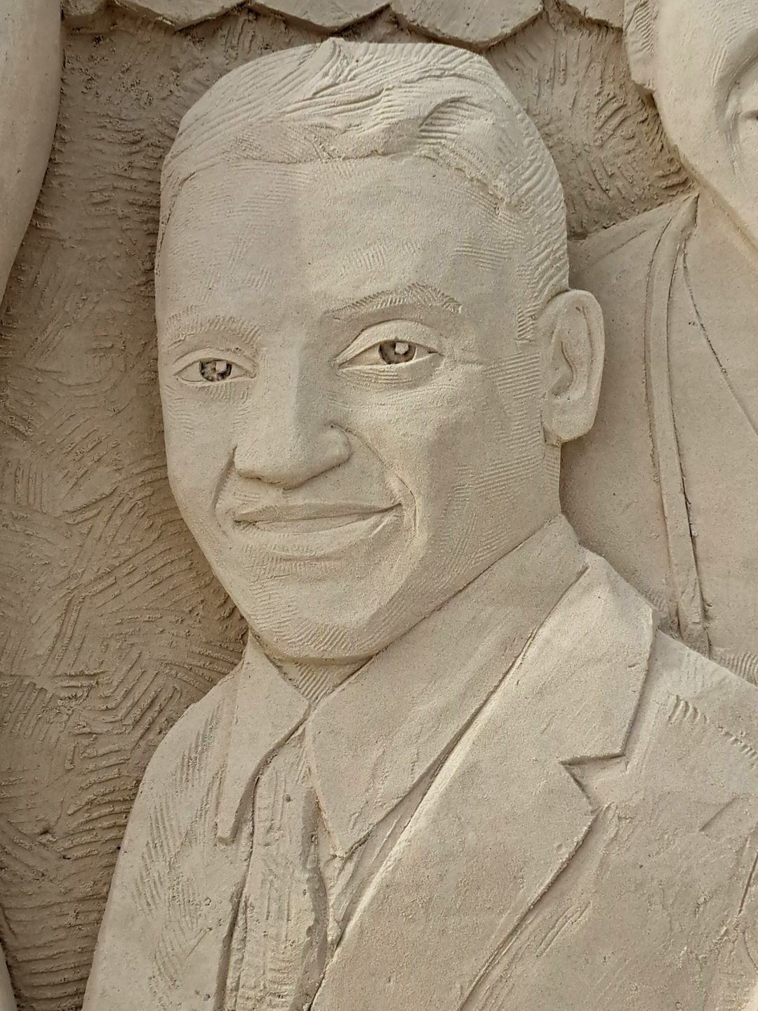 Sand sculpture of a face