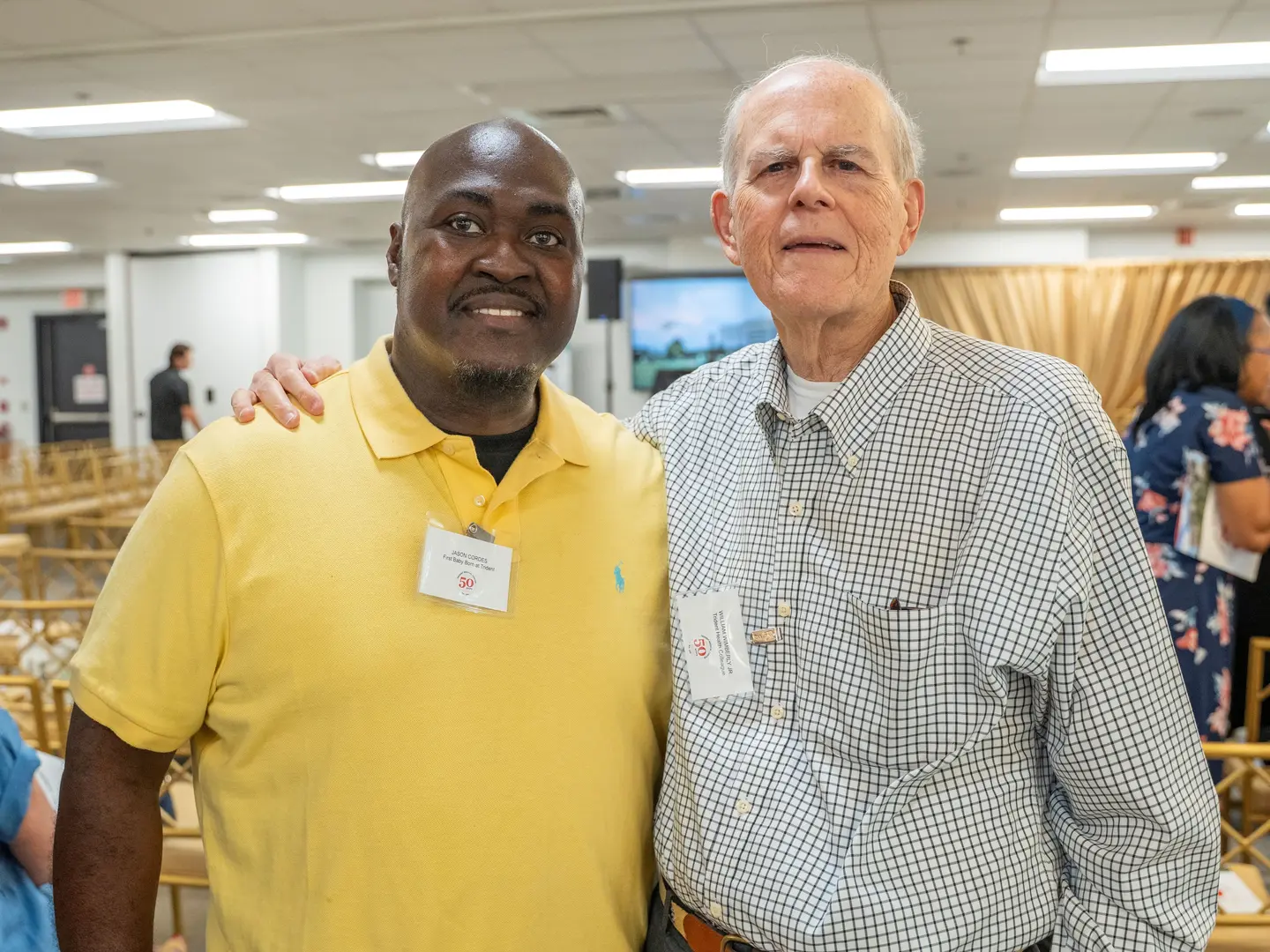 (l-r) Jason Cordes, the first baby born at Trident Medical Center, meets William Wimberly, MD, the physician who performed the first surgery at the hospital and who delivered Jason.