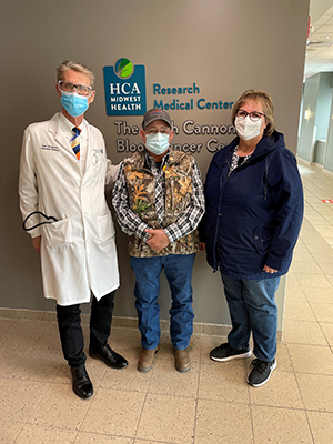 Tim Thompson with his partner Suzan and medical oncologist Frank Slovick.