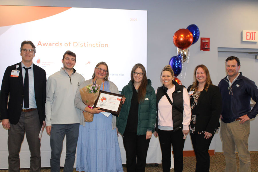 Dr. Taraneh Azar, MD, posing with family and colleagues after receiving the Frist Humanitarian - Physician Award.