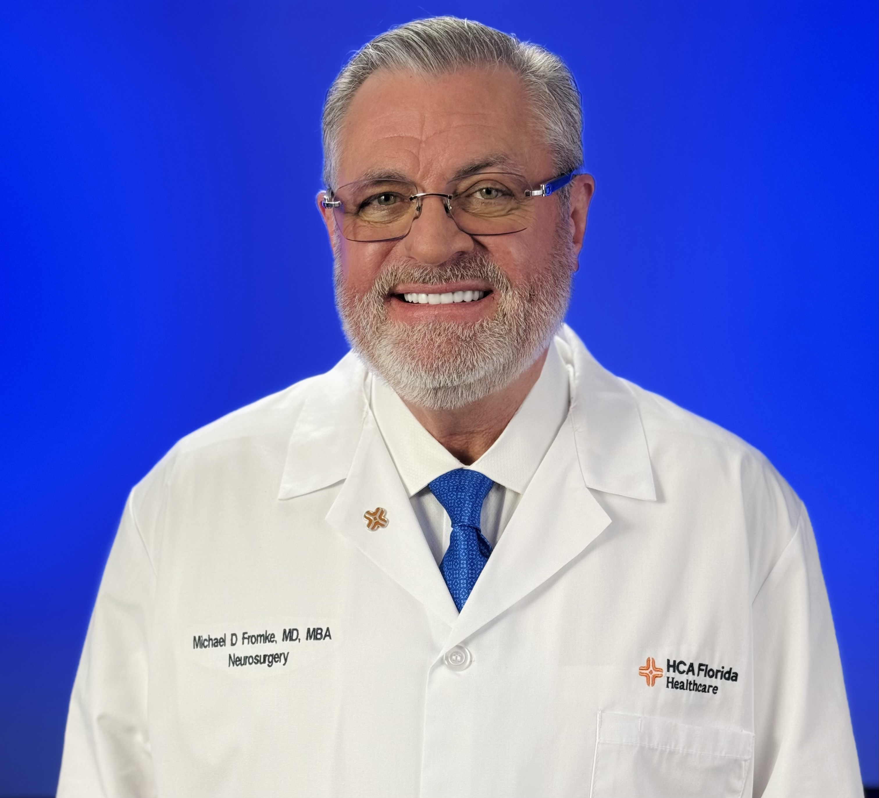 Dr. Michael Fromke headshot profile photo against solid blue background