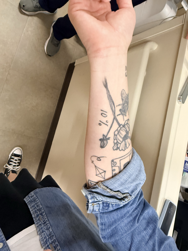 Lane's tattoo, written by her nurse, symbolizing her 10% recovery odds