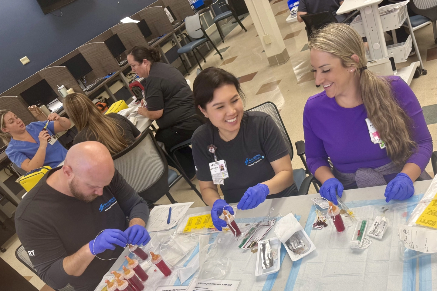 Some of the NICU nurses and Respiratory Therapists doing hands-on simulation learning.