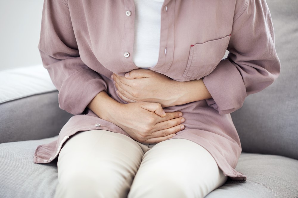 A woman holding her stomach