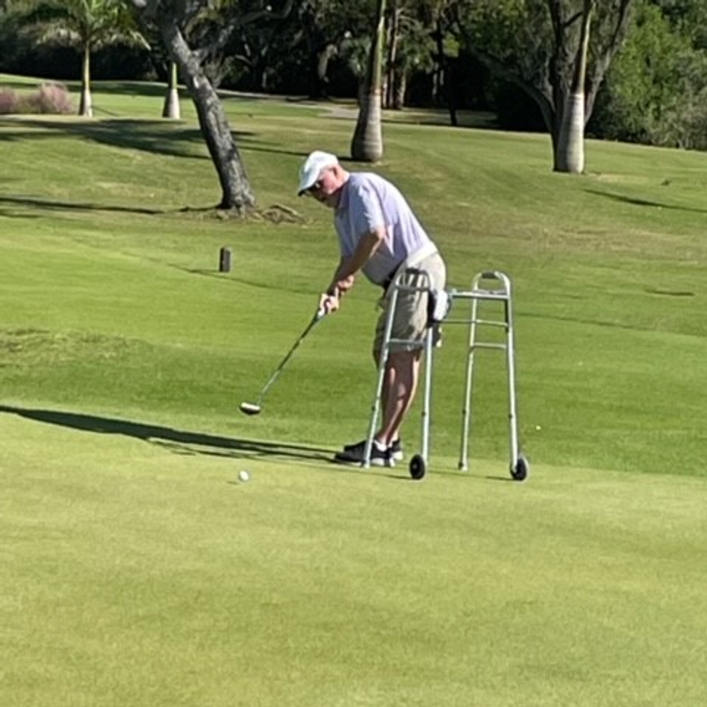 Kevin Nickels taking a golf put