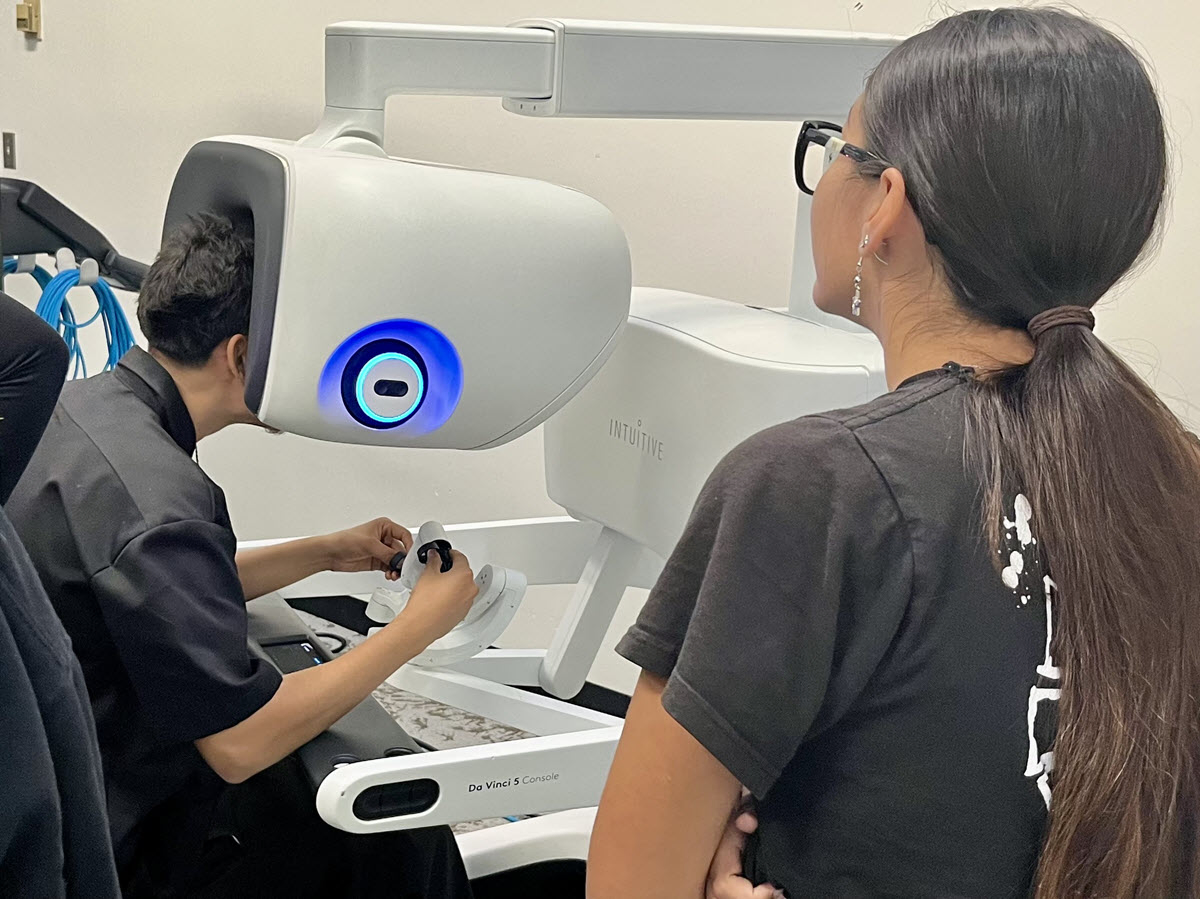 Student controlling one of the robots.