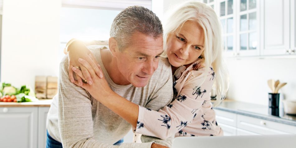 Senior couple read paperwork