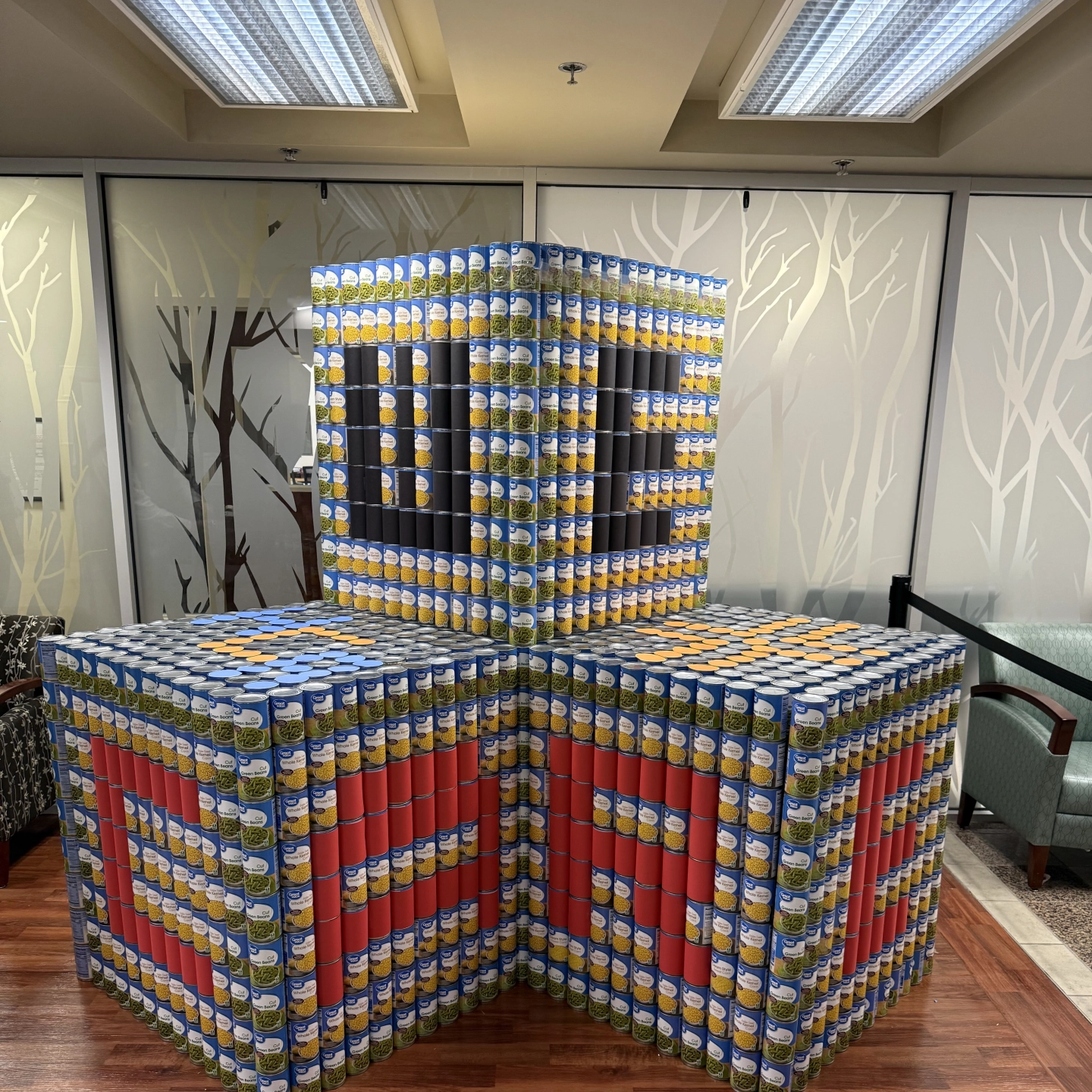 Large blocks of canned foods with We Care branding.