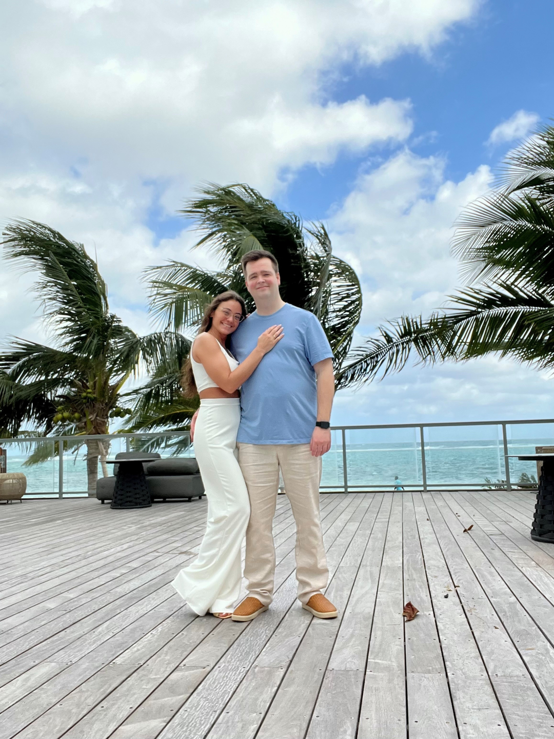 Photo showing of a young couple smiling for a picture.