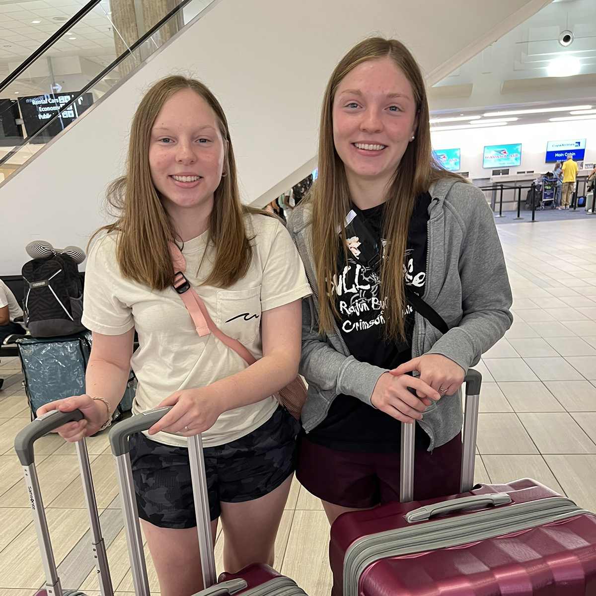 Hannah and kate with bags at airport on mission trip.