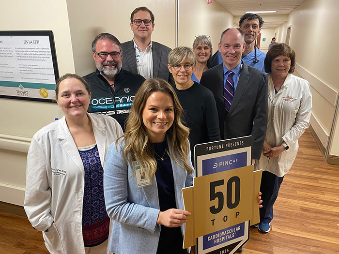 Group of employees happily celebrate winning top 50 award