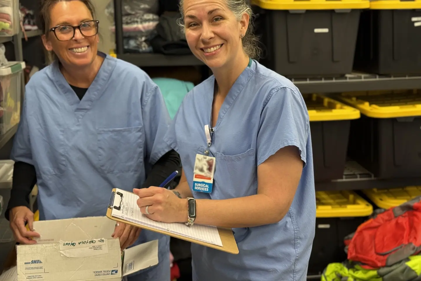 Registered Nurses Stefanie Knight and Operating Room Technician Laura Delmain inventory supplies in the Supplies 4 Success Teacher Store.