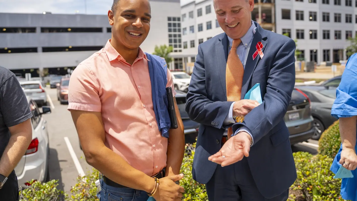 Trauma survivor Luke Pickering and Trident Health President and Trident Medical Center CEO Jeff Wilson joined event attendees at a butterfly release.
