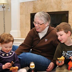 Carolyn Clemons playing with her grandchildren.