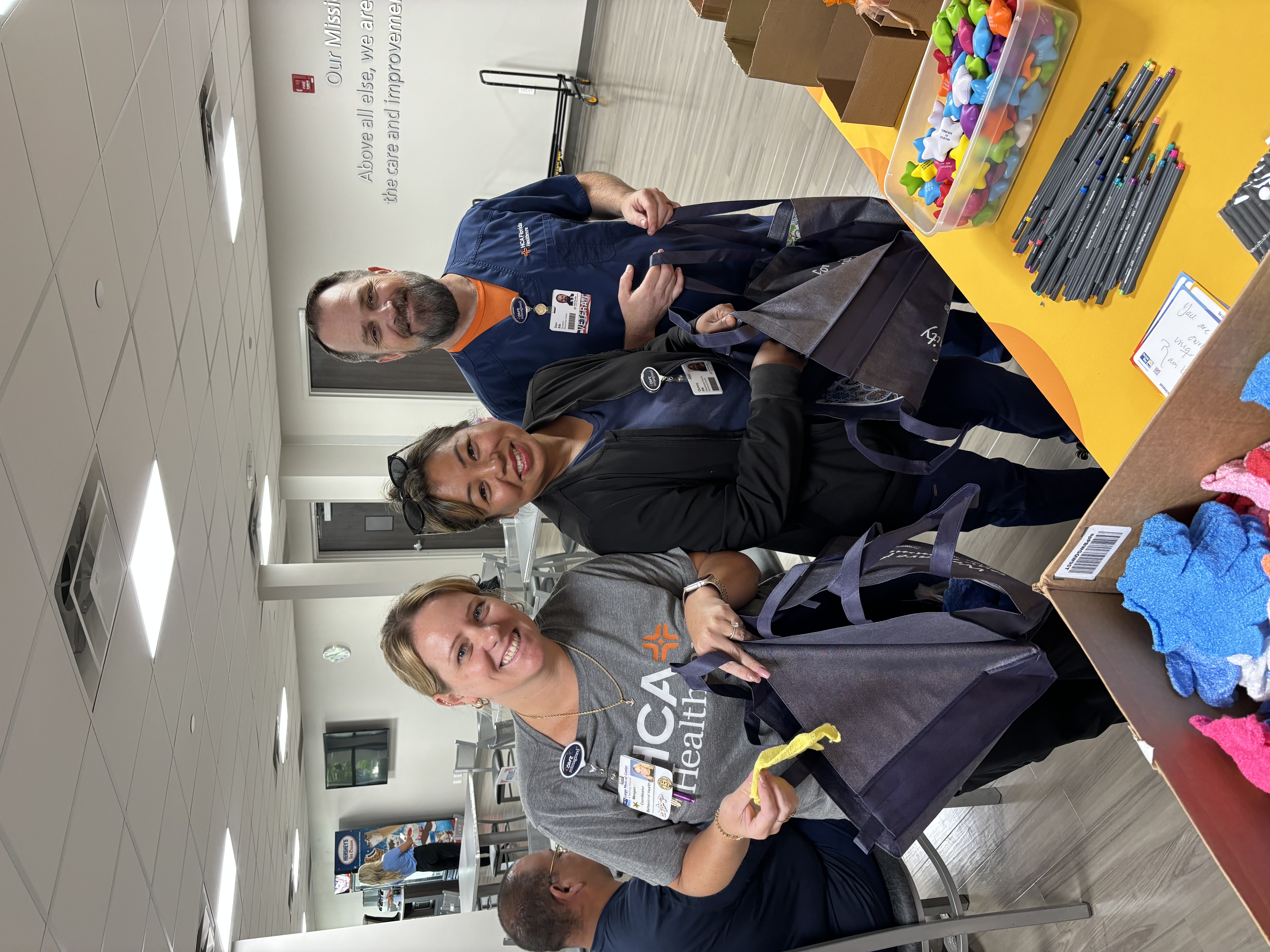 Hospital colleagues assembling mental health kits for community