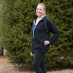 Wendy smiles while wearing workout clothes.