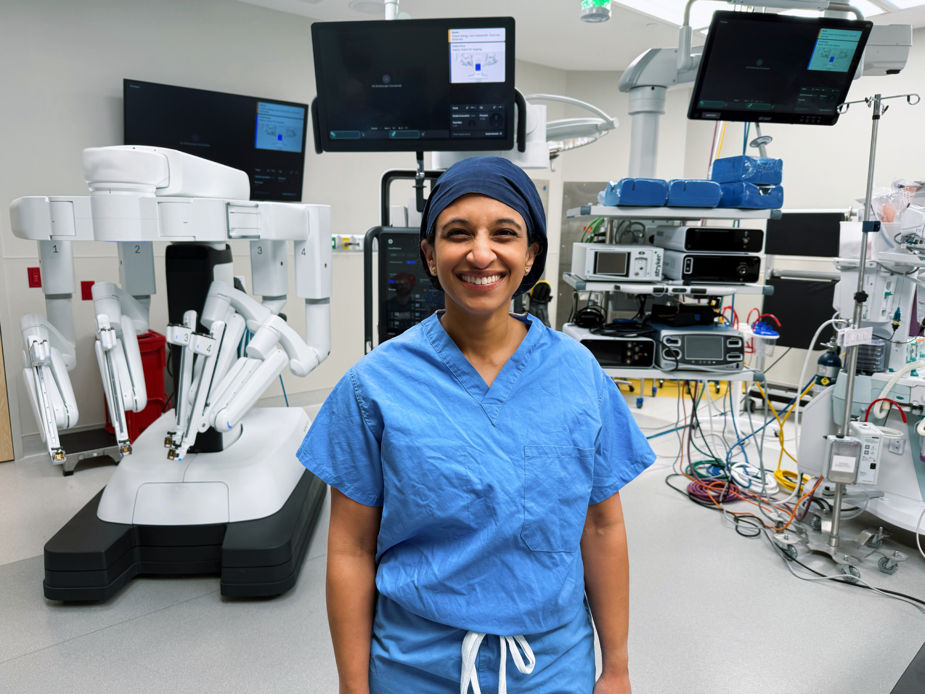 Dr. Susan Knoche standing in front of the operating equipment