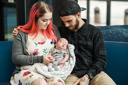 Baby Uriah Prowell with his parents, Sarah Prowell and Sean Kirby