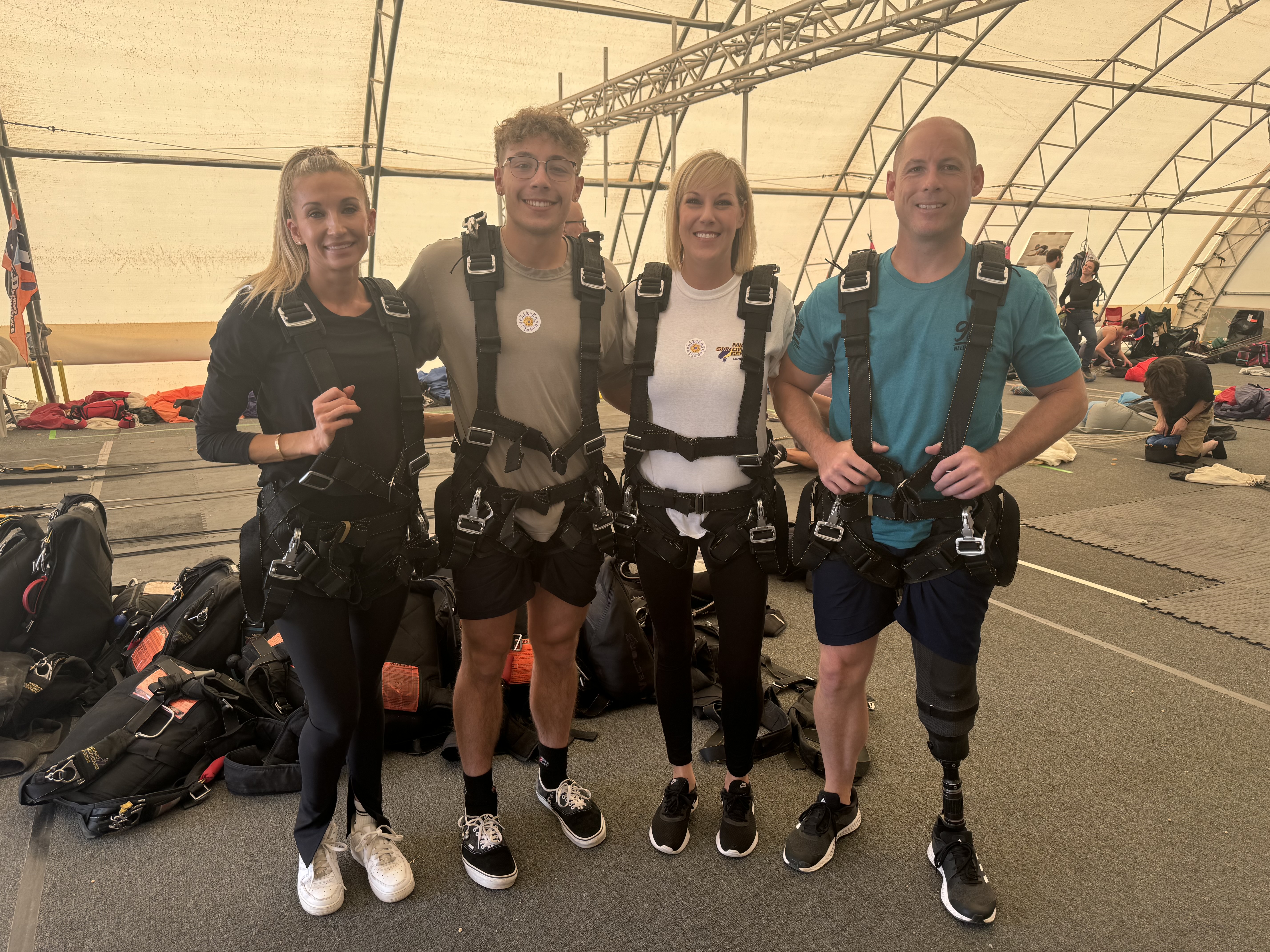 Grant (far left) and Mary (second to left) get ready for Mary's first skydive and Grant's second.