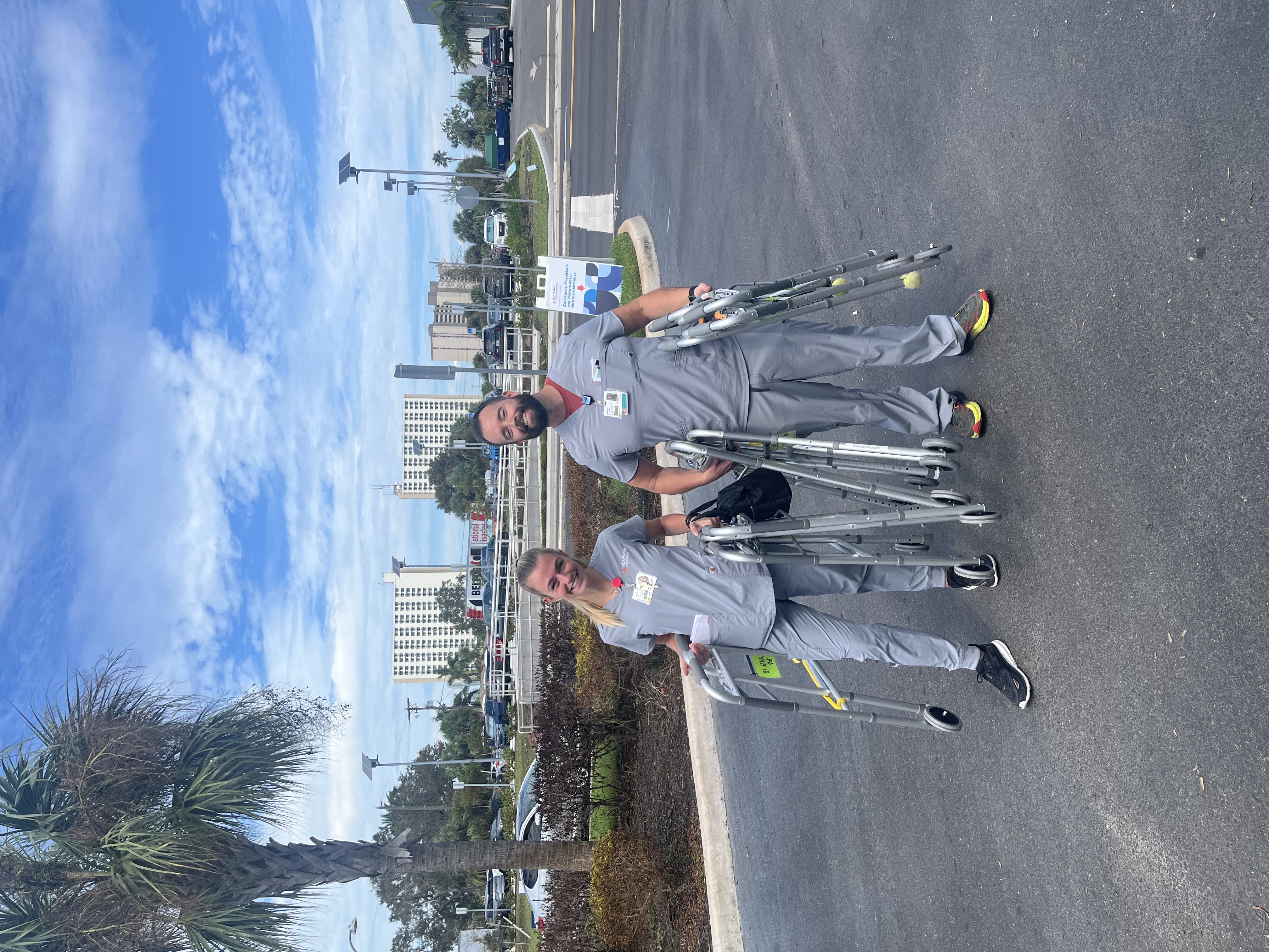 Two Pasadena Hospital nurses carrying walkers 