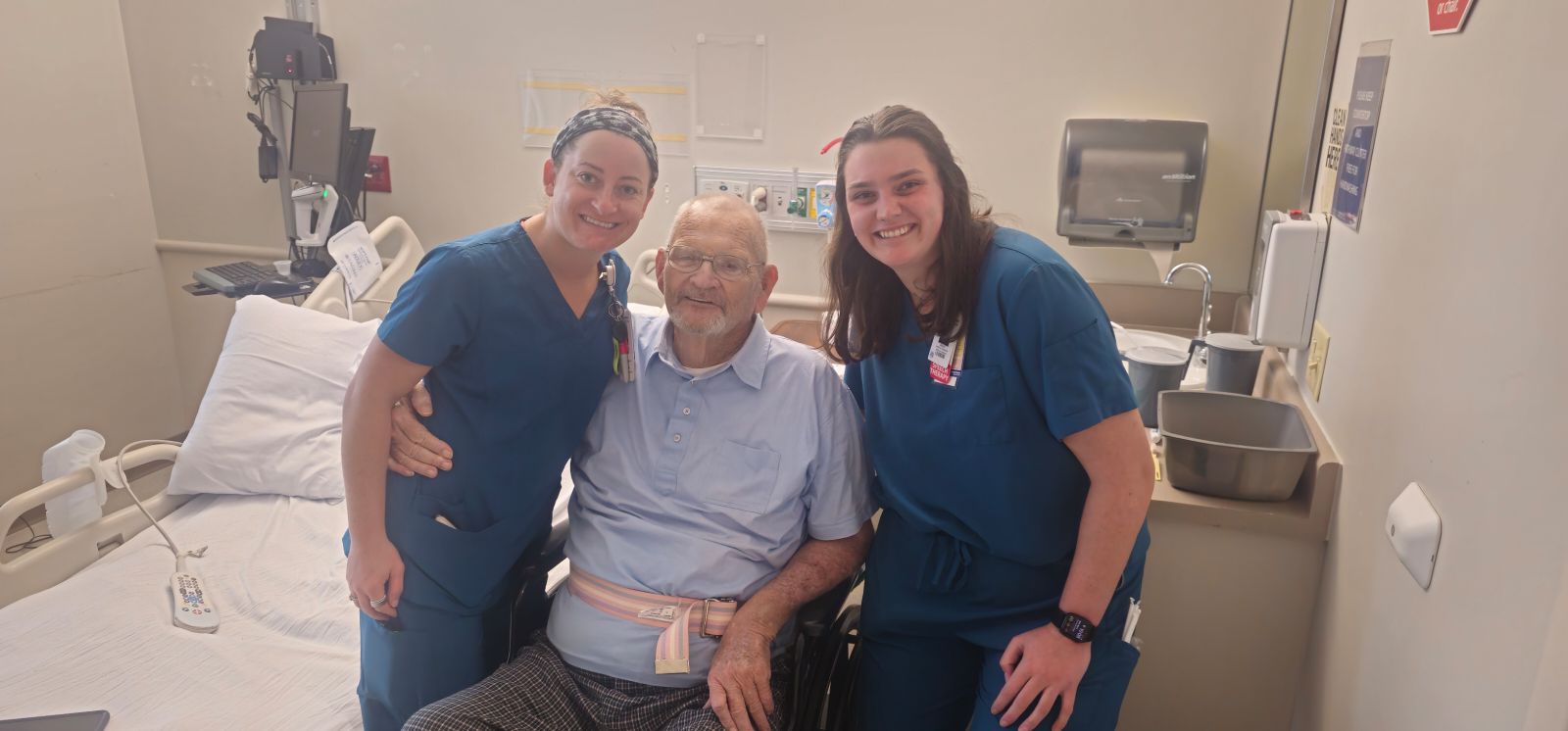 Pictured is rehabilitation colleagues Riley Davis and Elizabeth Klein with patient Michael Holton. 
