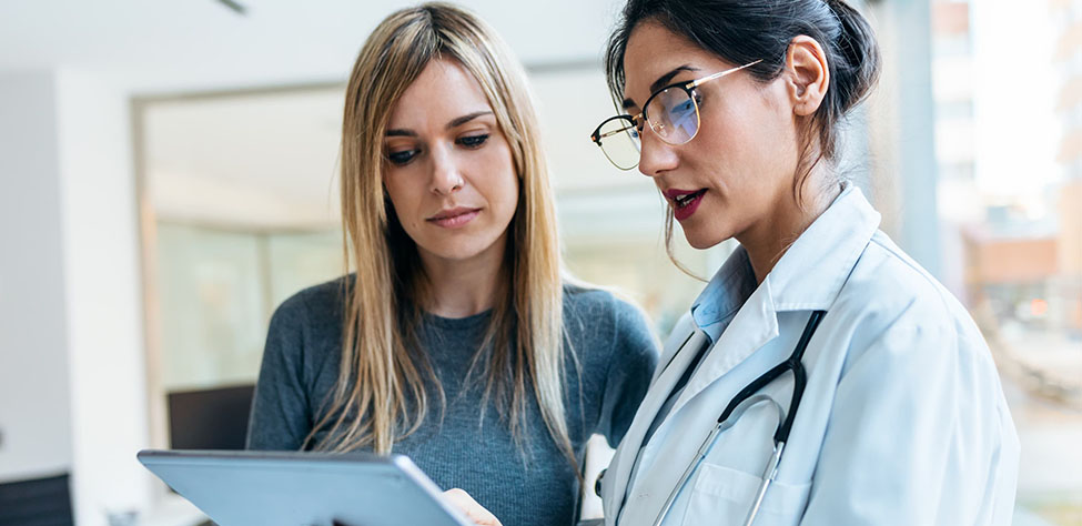 A provider goes over her patient's chart.