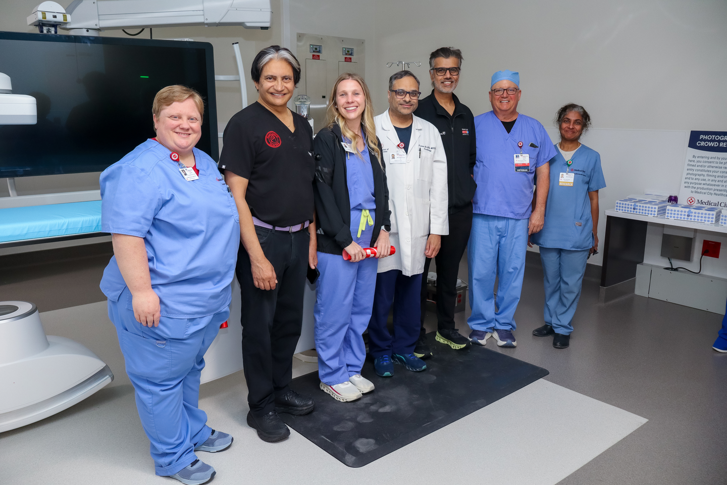 MCFW leaders smiling with clinical staff for a group photo