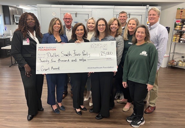 Dulles South Food Pantry staff and the StoneSprings Hospital Center colleagues celebrate the donation of $25,000 grant.