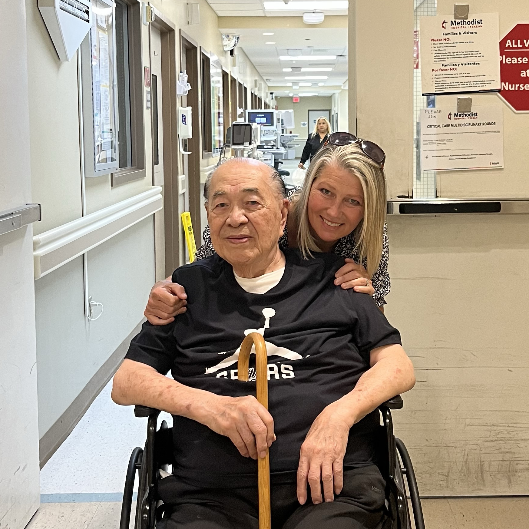 Danielo Tiongson in a wheelchair leaving the Intensive Care Unit, walking cane in hand.