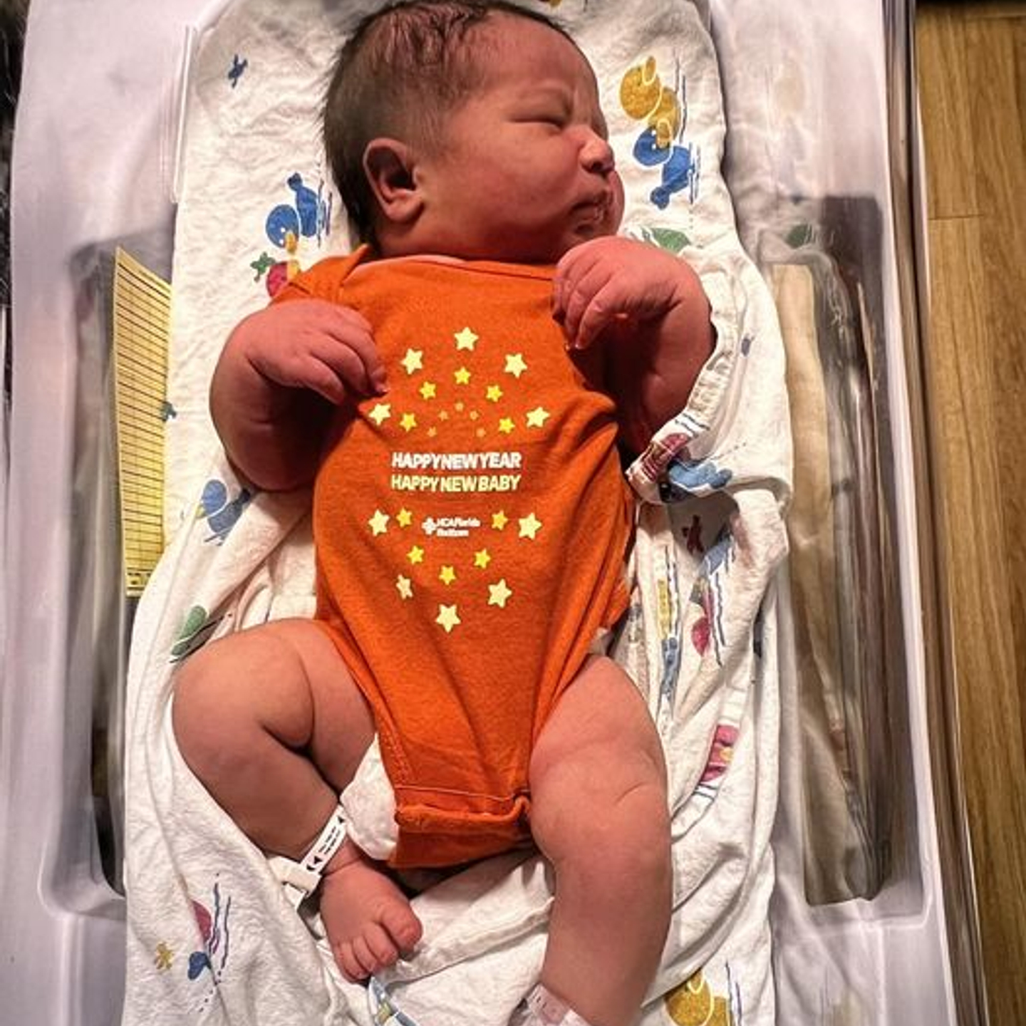 Dominic Quinones is sleeping in his Happy New Year onesie.