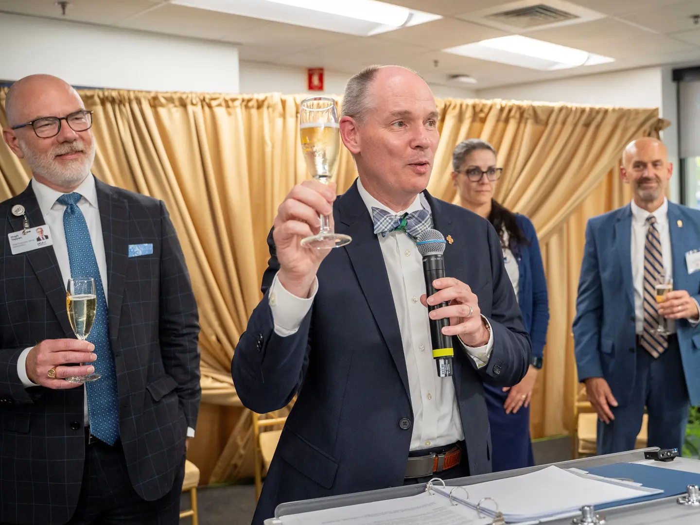 Trident Health President and Trident Medical Center CEO Jeff Wilson invites guests to join him in a toast that was 50 years in the making.