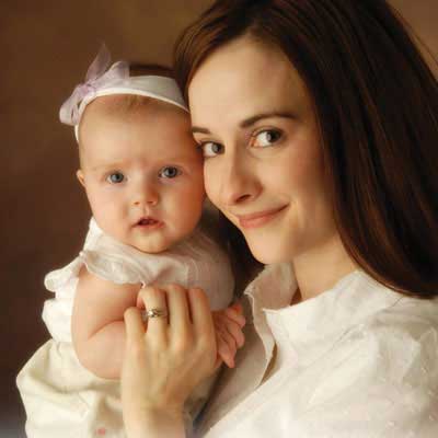 Jody Neeley smiles while hugging her daughter.