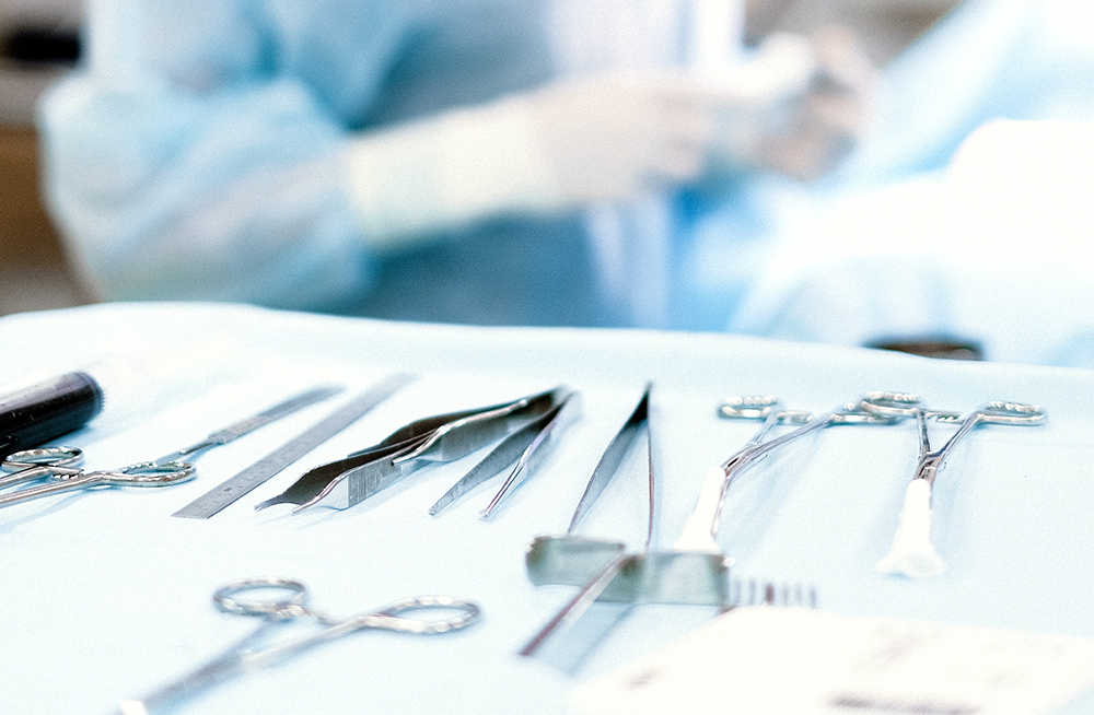 Up-close view of surgical instruments in an operating tray.