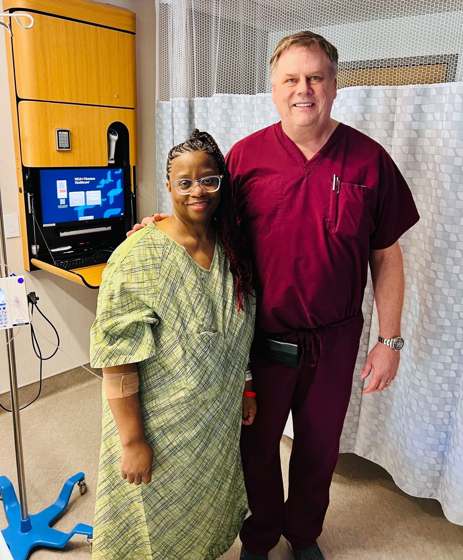 Lavera Strange and Dr. Terry Scarborough standing together in hospital room