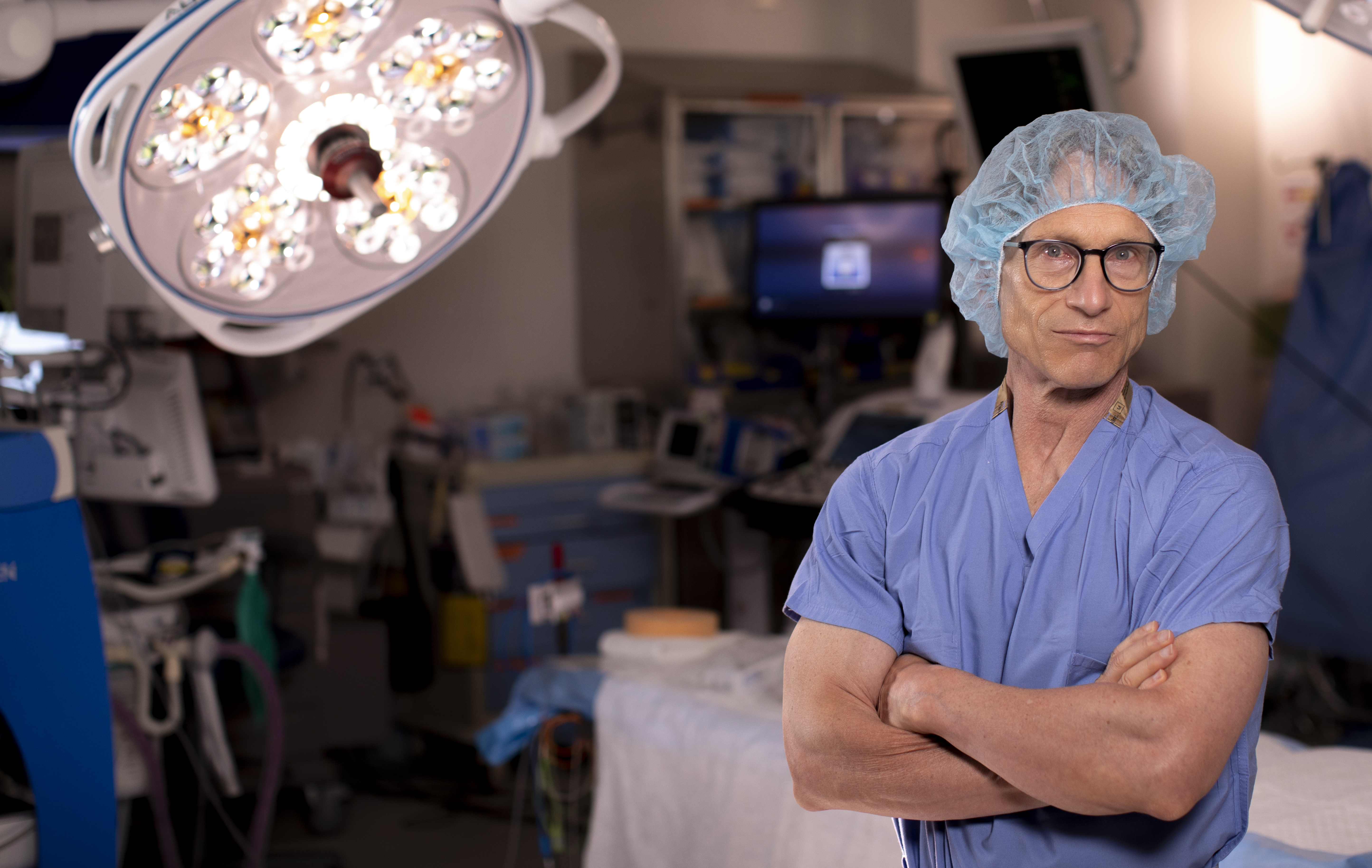 Photo of Dr. Falci standing in an operating room.